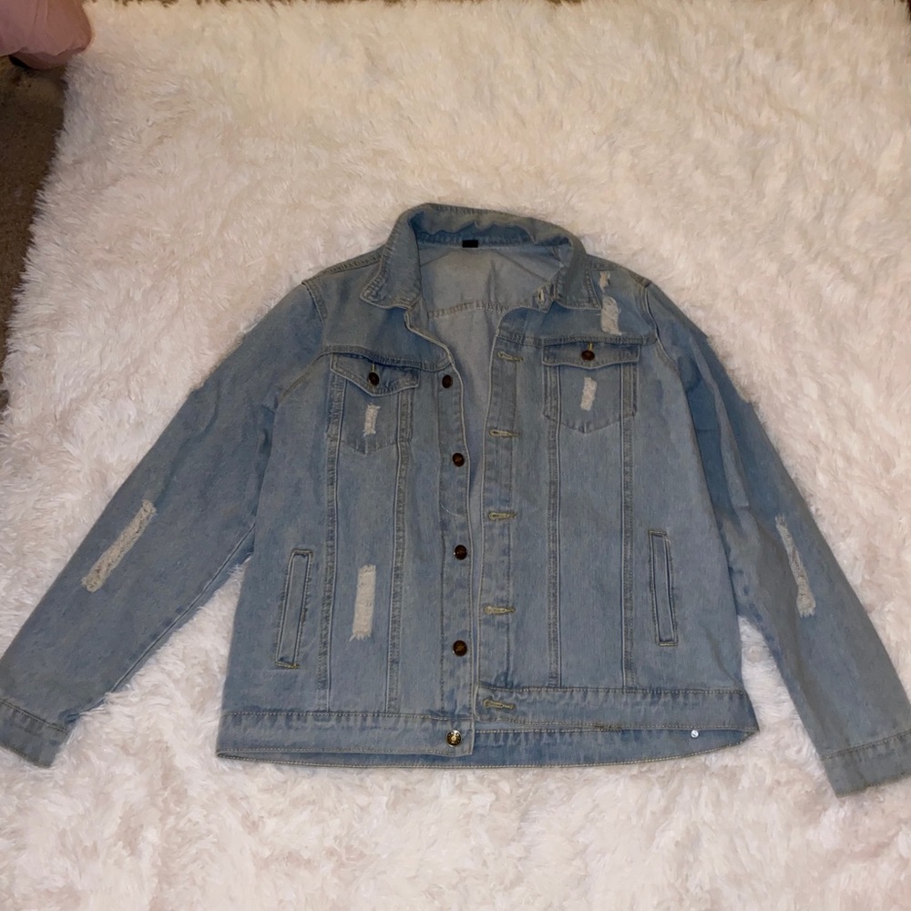 Blue ripped jean jacket